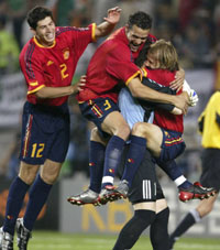 Spanish players embrace goalkeeper Iker Casillas