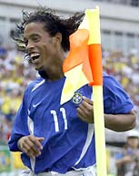 Ronaldinho celebrates after scoring. 