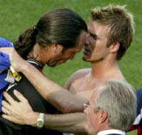 Beckham consoles Seaman after the match.
