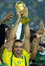Ronaldo is all smiles as he holds aloft the trophy. 