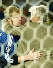 German coach Rudi Voeller consoles Oliver Kahn after the final. 